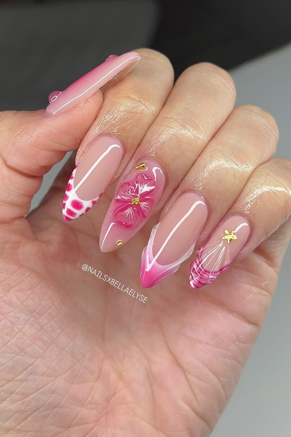 Looking for cool summer nails for 2025? See this pretty pink design with a flower and French tips. Find your next nail idea!
