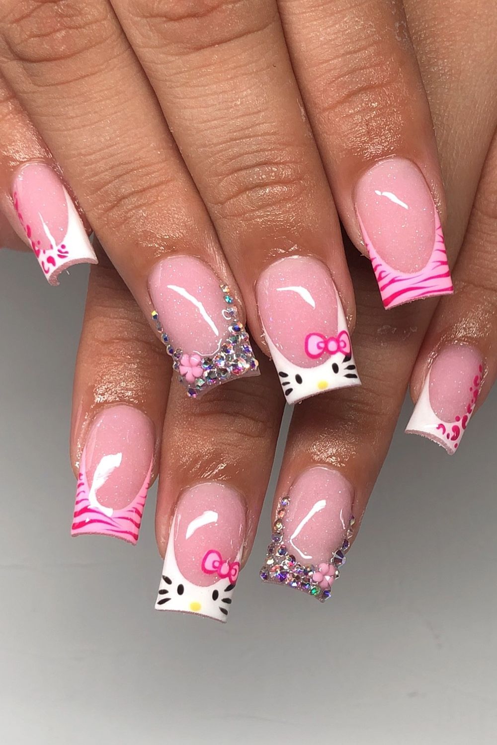 Want cute pink nails? Check out Hello Kitty bow nail art 2025!