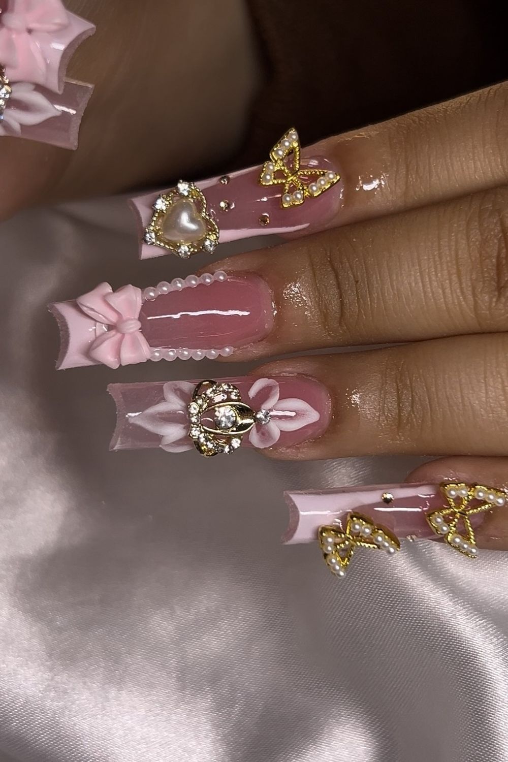 Pink bow heart crown butterfly nails 2025 - See these pink nail ideas!