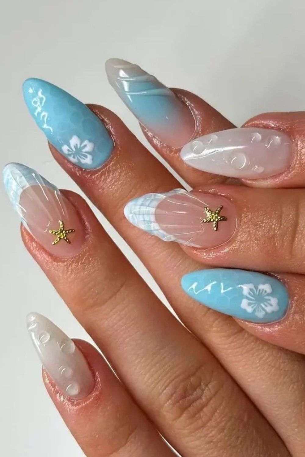 Looking for amazing summer nails for 2025? Check out these blue beach designs with starfish, flowers, and shell details! Find your perfect summer look now!