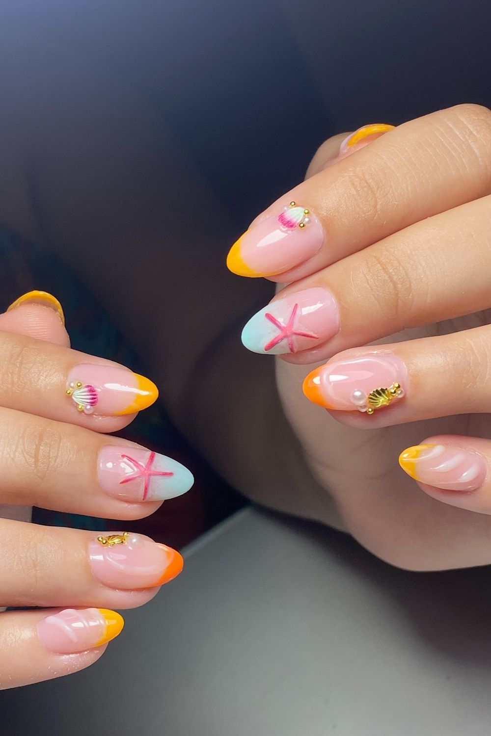 Summer nails 2025 beach design starfish shells orange yellow tips