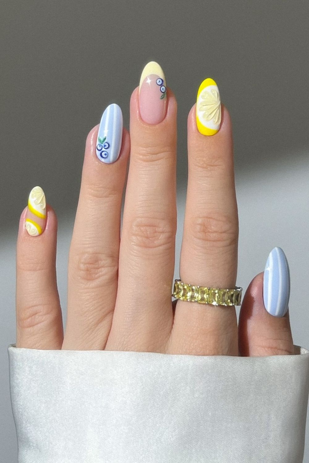 Are you searching for cute summer nails for 2025? This picture shows fun fruit and stripe designs. See our collection of summer nail ideas and get inspired!