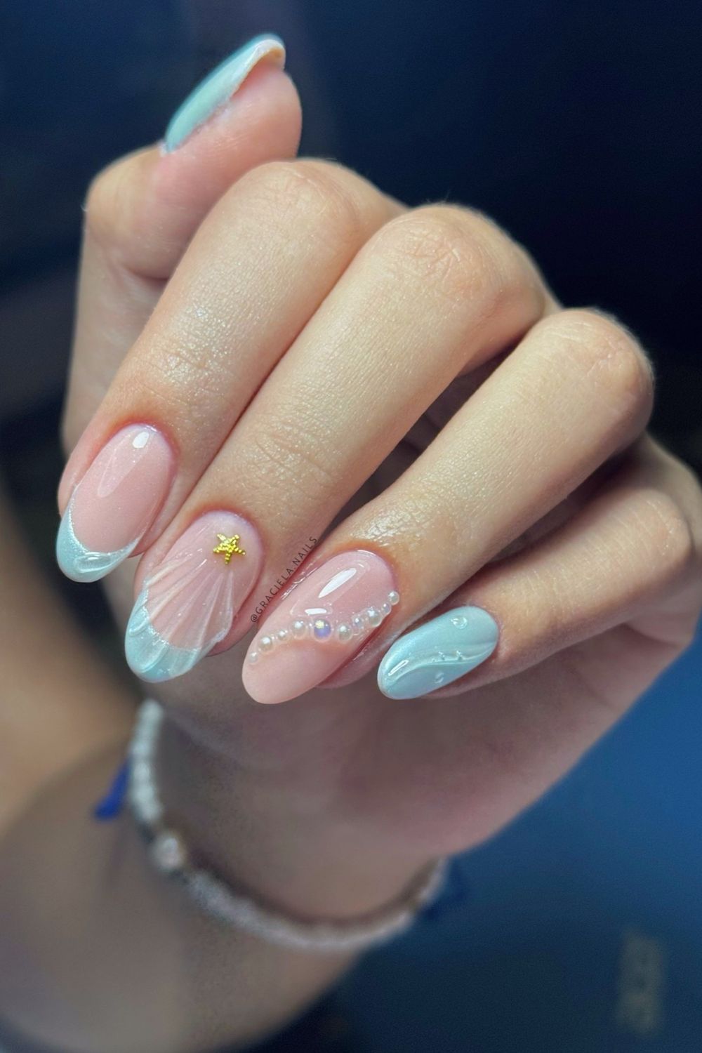 Searching for the best summer nails for 2025? Look at this stunning mermaid design with blue tips, pearls, and a starfish! Discover more summer nail ideas for every skin tone!