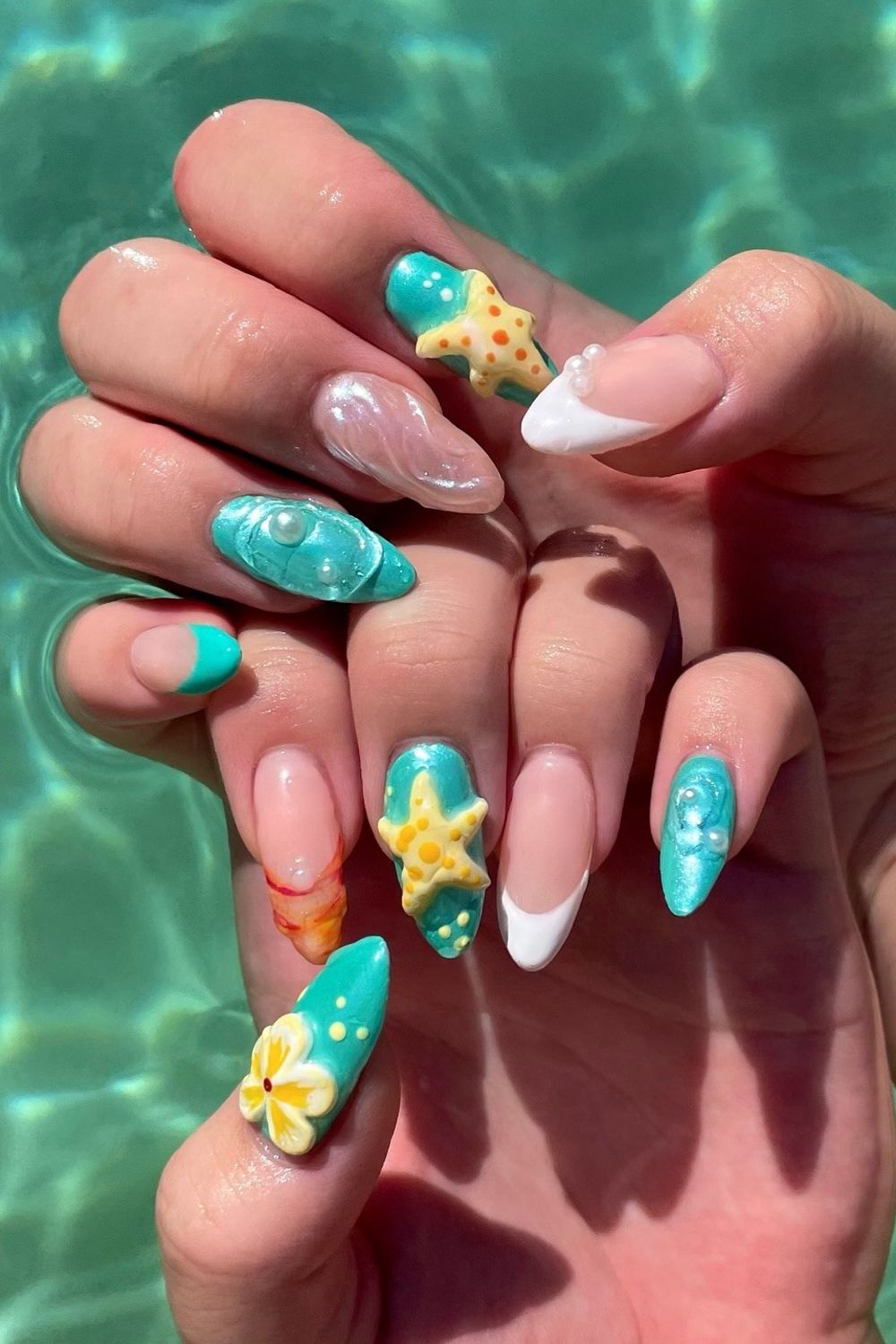 Looking for the best Summer Nails 2025 ideas? See this fun ocean design with starfish, pearls, and blue colors! Find your perfect summer manicure.