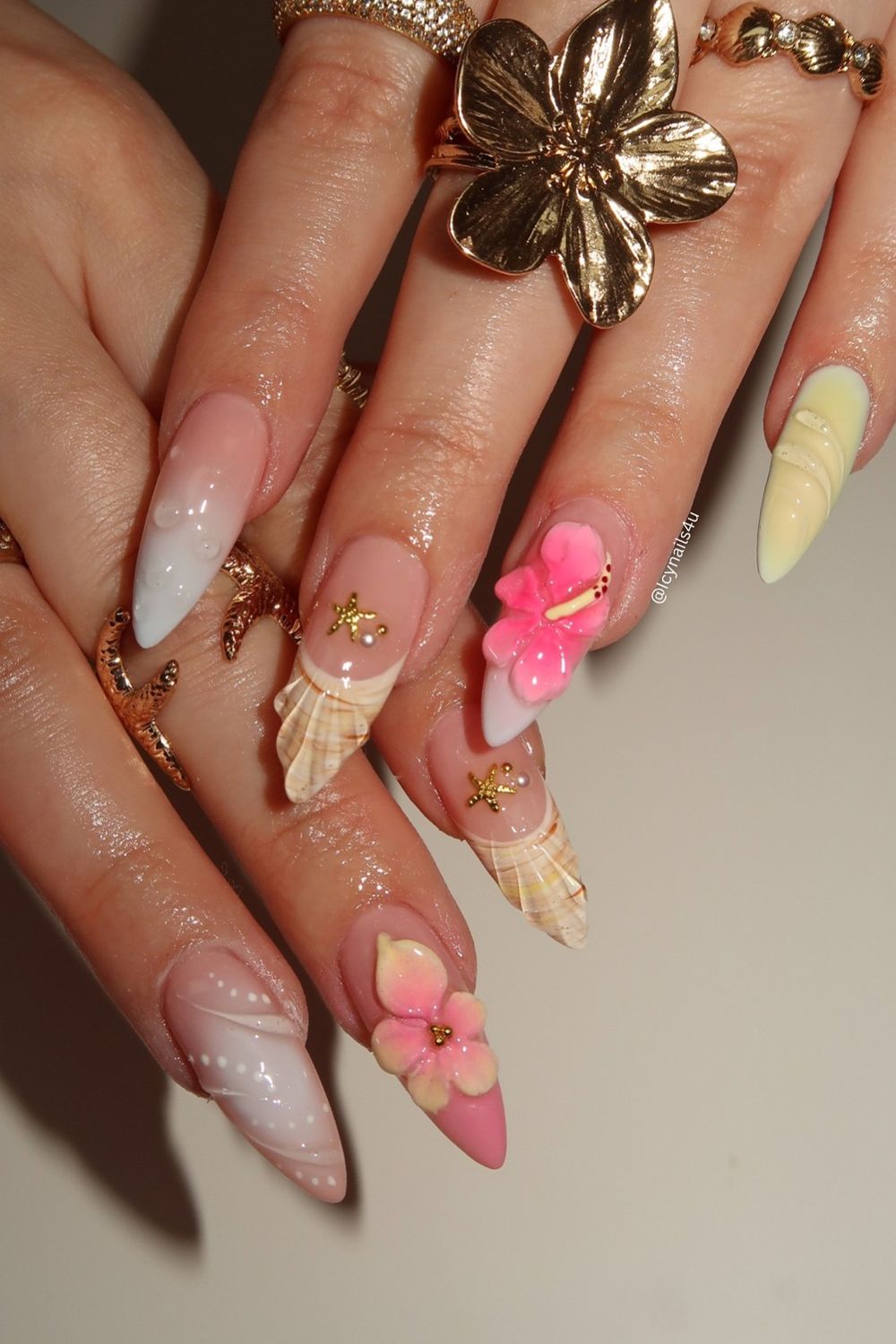 Looking for summer nail ideas 2025? Get inspired by this tropical beach design! Features long pink nails with 3D flowers, seashells, and starfish.