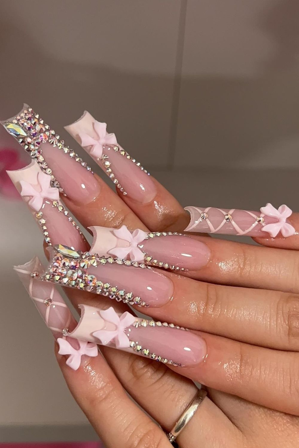 Dreamy pink bow nails 2025 designs. Click for luxury nail inspo!