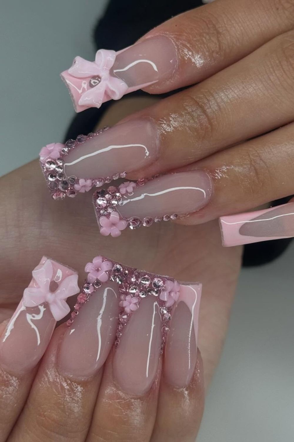 Obsessed with pink nails? Discover luxury pink nails with white bows & rhinestones! Click for 2025 designs!