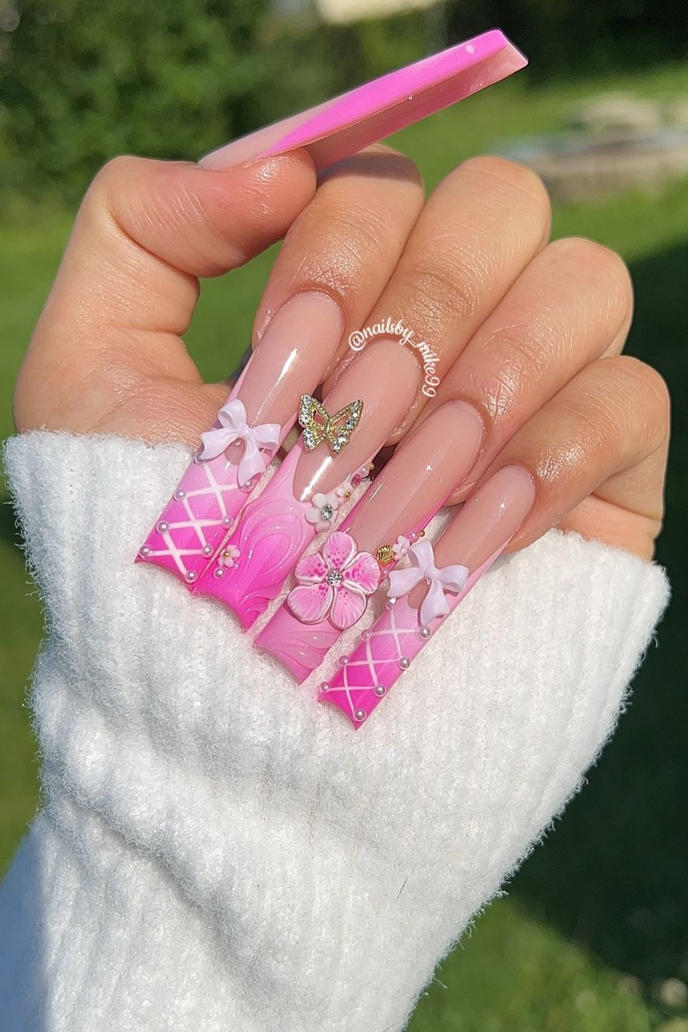 Looking for cute pink nail designs? Check out these pink nails with bows, flowers, and a butterfly for 2025! Get inspired and see more pink nail ideas now.