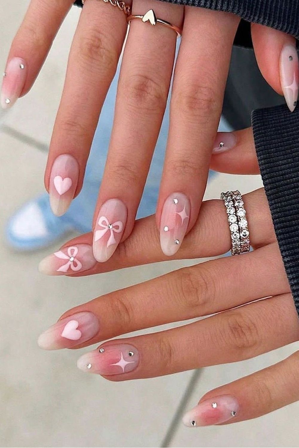 Looking for cute pink nails? Check out these pink nails with bows and hearts for a sweet 2025 nail style!