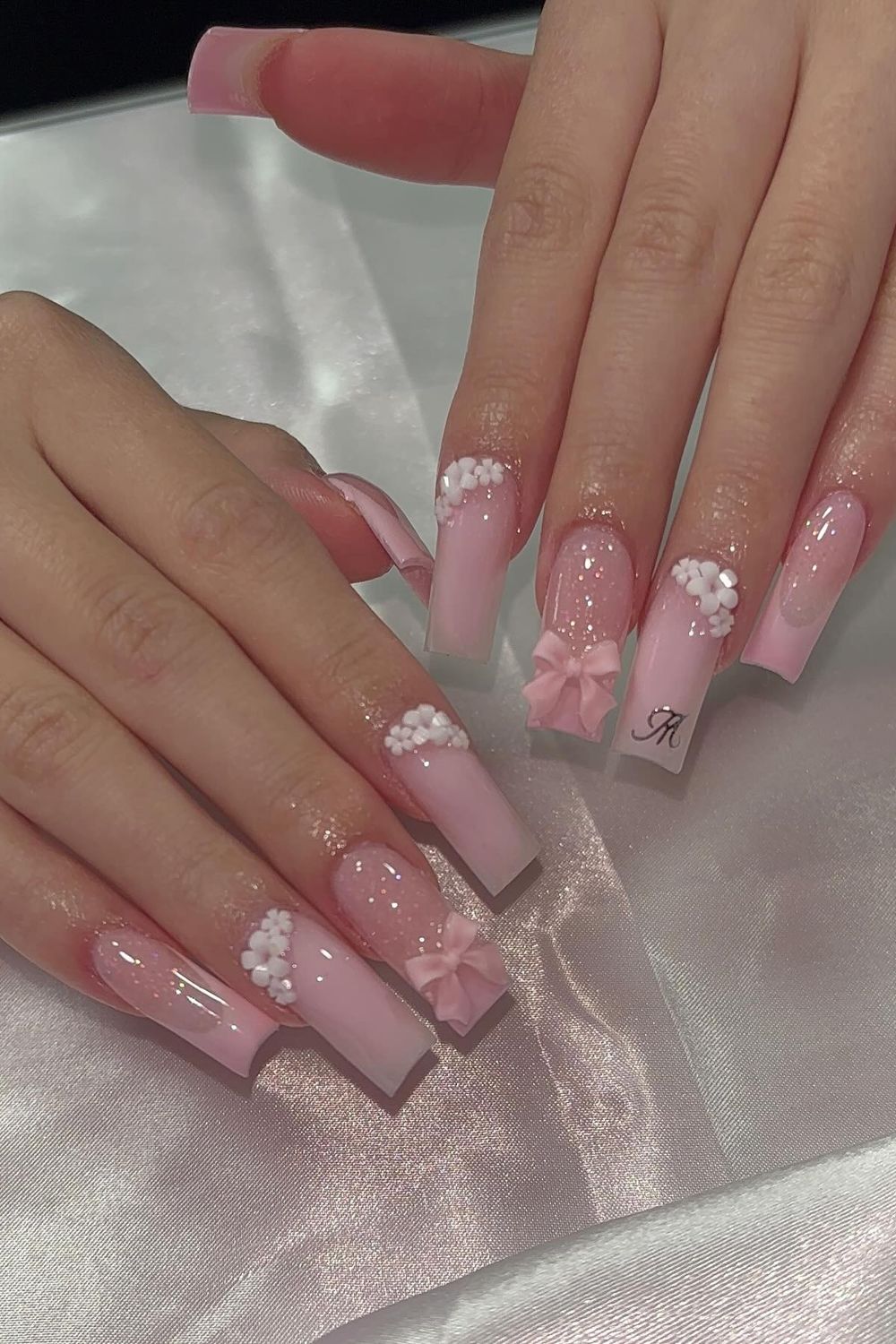 Discover cute pink nails with white bows for 2025. Click to see more pink nail ideas!