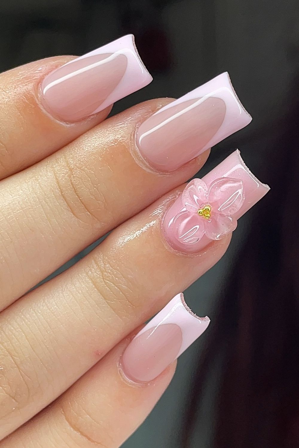 Want cute pink nails? Explore these pink French tip nails with 3D flower for your next nail look!