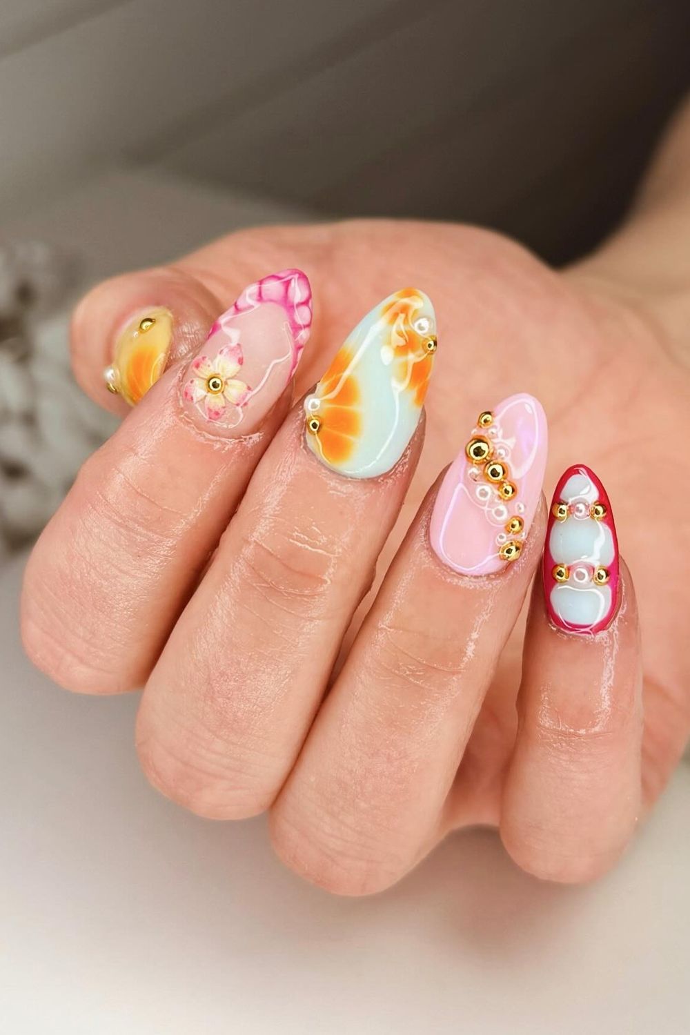 Looking for amazing summer nail ideas for 2025? See our collection of colorful mix and match nail art with flowers and beads and get inspired for your next manicure!