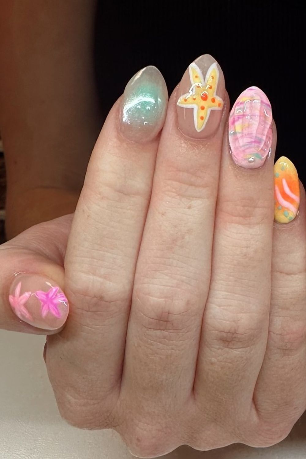 Are you looking for Summer Nails 2025 ideas? See our collection full of beach-themed nail designs like starfish and seashells and get inspired!