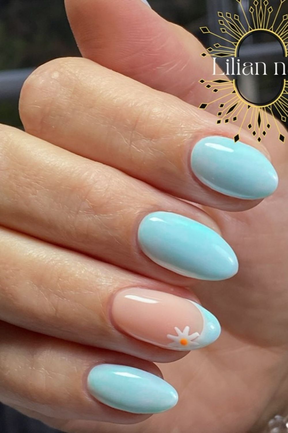 Looking for cute summer nail ideas for 2025? See this lovely light blue and daisy French tip design! Find your perfect summer nails 2025 now!