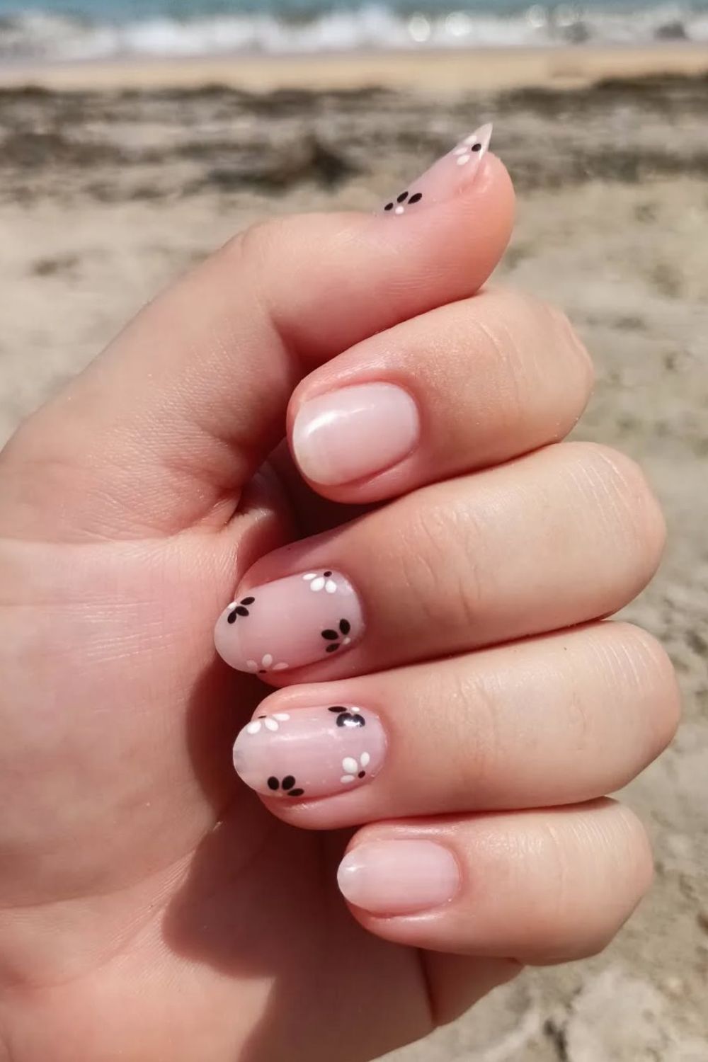 Searching for the best Summer Nails 2025 for every skin tone? This sheer pink nail look featuring sweet flower art is a top pick. Get inspired by tons more 2025 nail ideas!